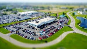 blurred bird's eye view of auto dealership