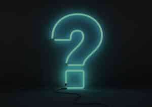 blue ethic advertising agency neon question mark on black background