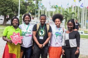 group of people with think for the children sign for charity