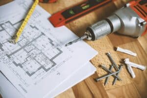 tools and floor plan on table for construction